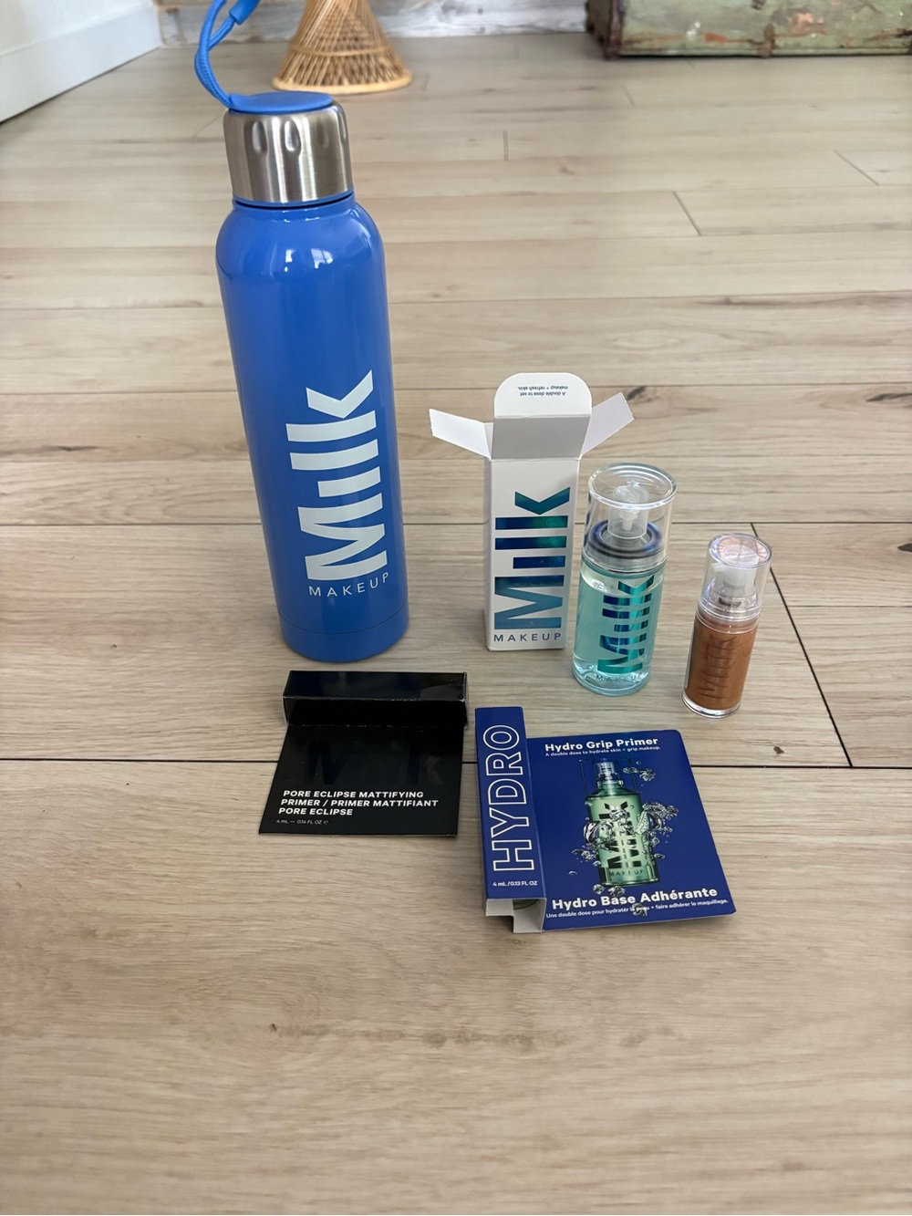 Milk Makeup Blue Stainless Water Bottle & 4 Trial Size Skincare Set